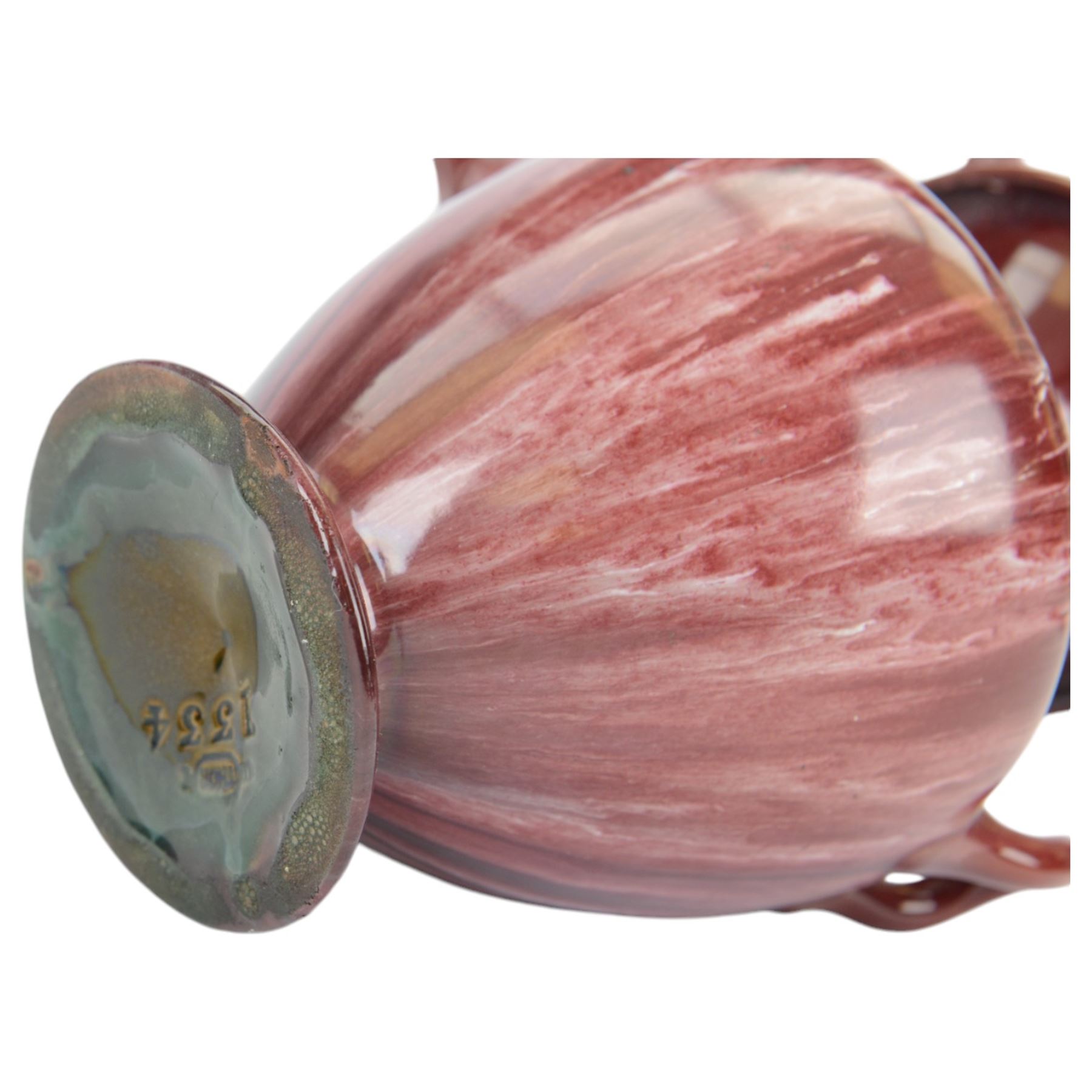 Linthorpe Pottery, pair of twin handled vases, with a purple glaze, H20cm