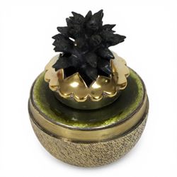 Late 20th century silver and silver-gilt surprise egg, the textured gilt exterior opening to reveal a clutch of chicks, the clustered heads supported upon a spring, within a jagged and lobed silver and gilt encasement, with green enamel surround, hallmarked Stuart Devlin, London 1982, H7cm