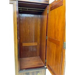 James Shoolbred & Co. London - Edwardian inlaid mahogany triple combination wardrobe, projecting dentil cornice over bevel glazed door, two figured oval panelled doors and four drawers, the central compartment fitted with linen slides and drawers, satinwood banding, on base with shaped apron and bracket feet, with enamel plaque 