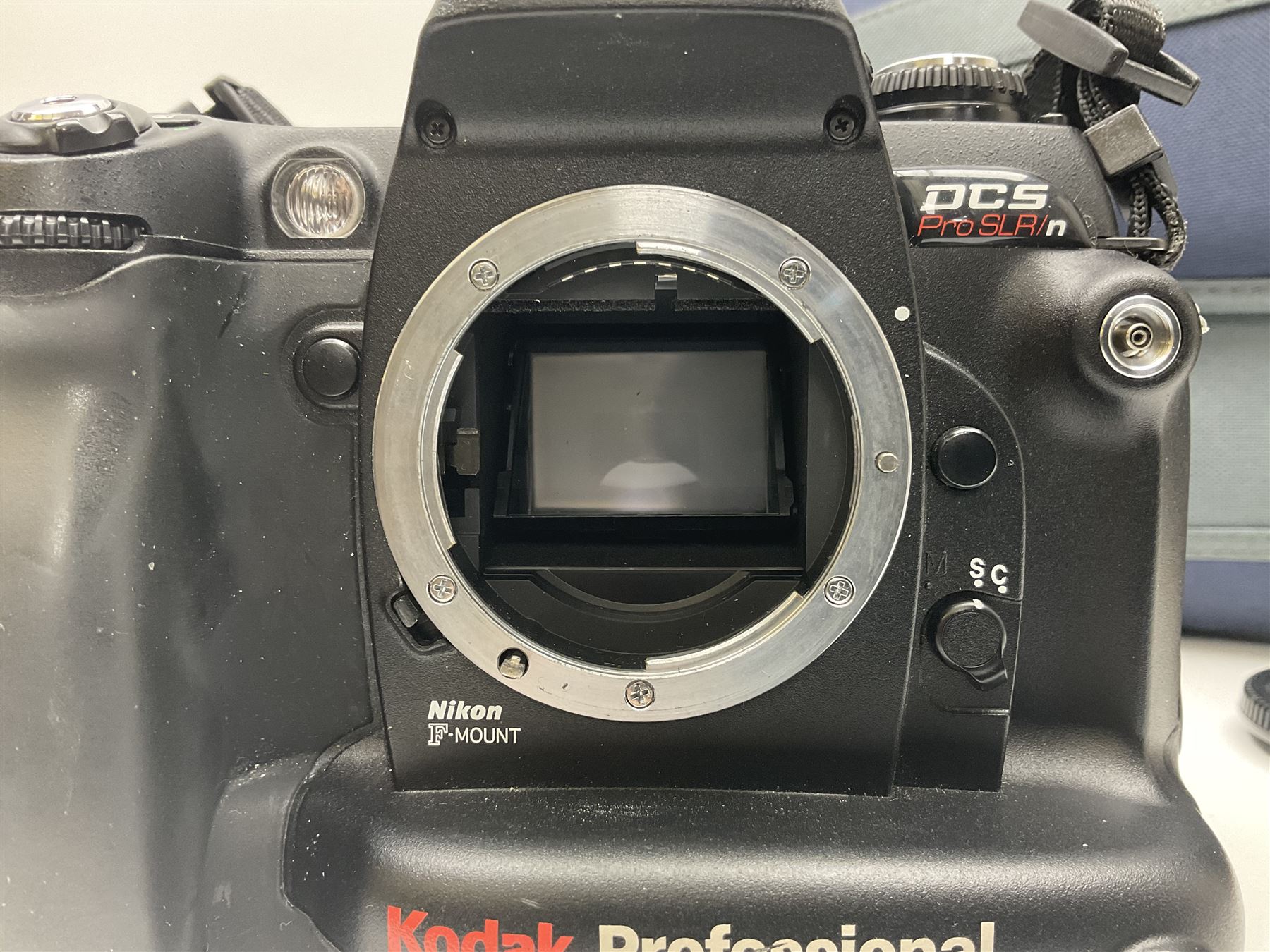 Kodak DCS pro, with Nikon F80 mount, serial no. PSLRN24607, with three batteries, charged, instruction manual and a carry case