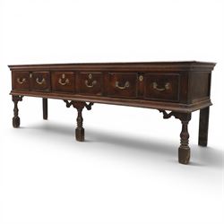 17th century 8’ oak dresser base with moulded front, rectangular top, above four drawers, raised on turned and block support 