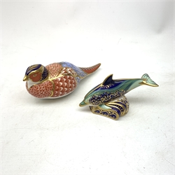 Two Royal Crown Derby paperweights, the first modelled as a Pheasant, the second as a Baby Bottlenose Dolphin, each with mark beneath, and gold stopper.   