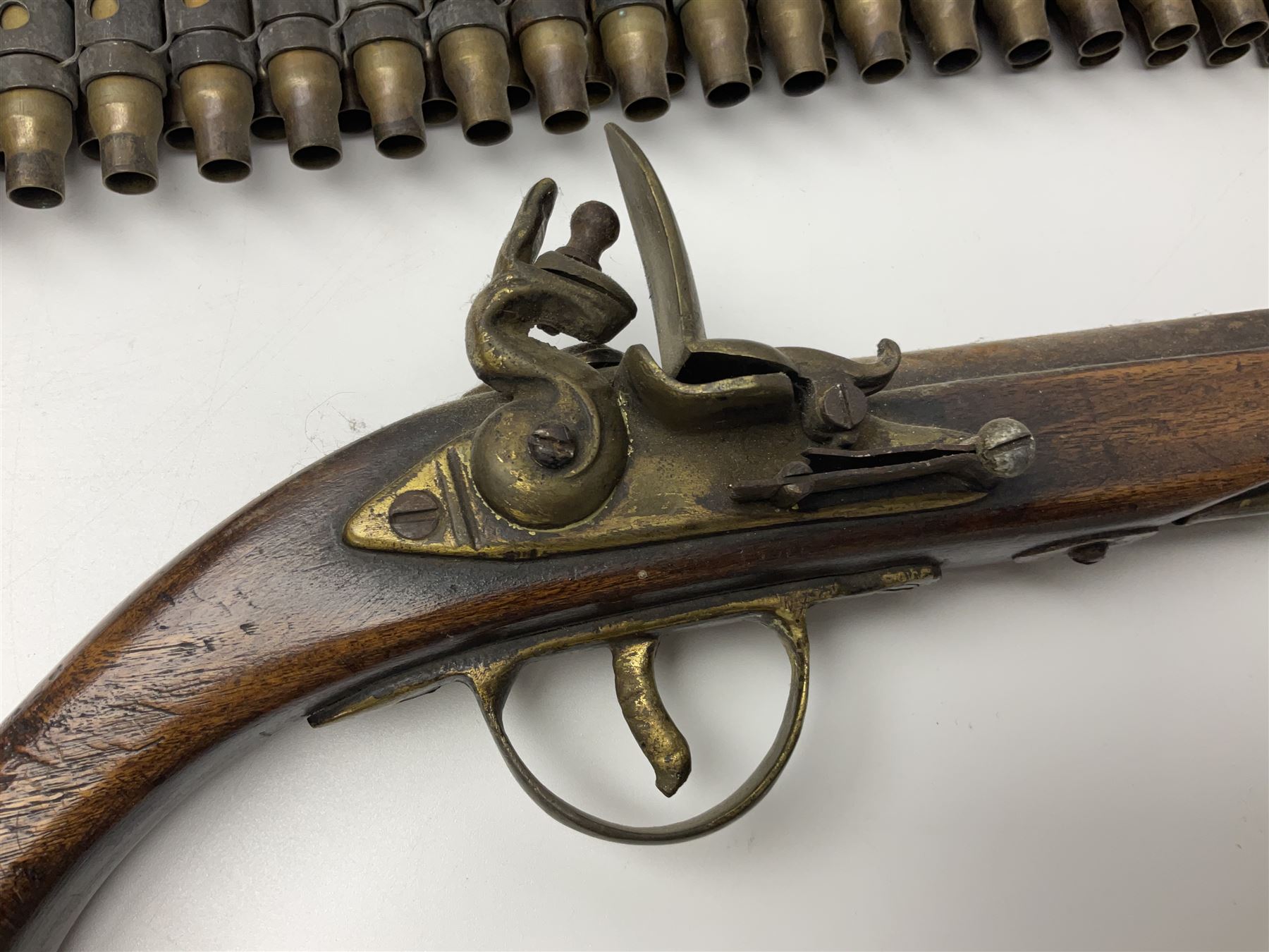 Leather covered swagger/sword stick with 40cm steel blade L62cm overall; another ash sword stick with 30cm diamond section steel blade; pair of fencing foils, the blades marked Solingen; two reproduction flintlock pistols; and 92cm inert cartridge belt (7)