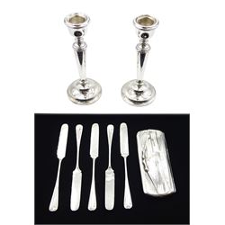 Pair of silver candlesticks by P H Vogel & Co, Birmingham 1970, silver spectacle case by W J Myatt & Co, Birmingham 1920 and five silver butter knives by James Dixon & Sons Ltd, Sheffield 1919