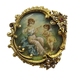 19th century painting on ivory depicting Cupid and maiden, in ornate gilt brooch set with split pearls and garnets