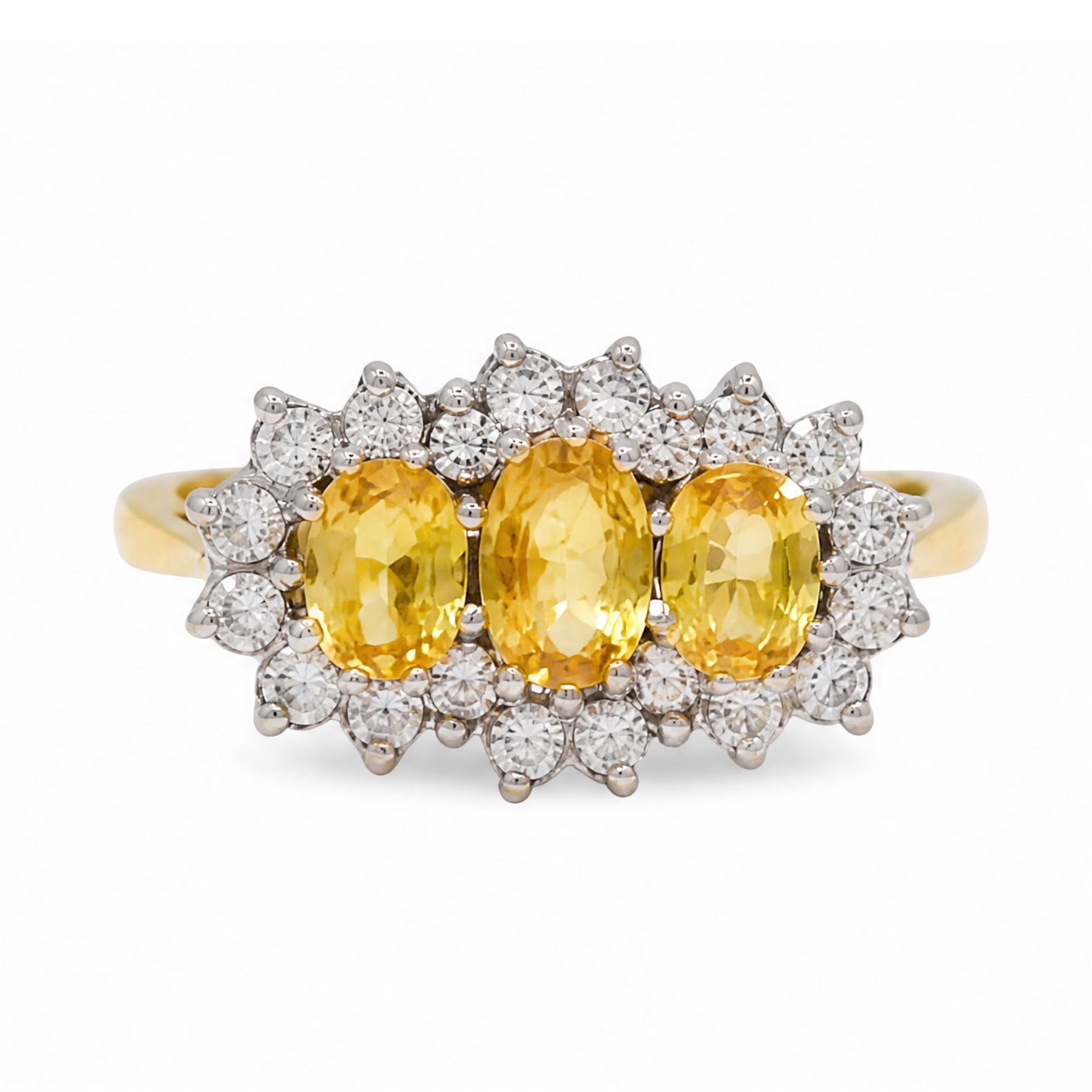 18ct gold yellow sapphire and diamond cluster ring, three oval cut sapphires, surrounded by twenty round brilliant cut diamonds, London 1988, total sapphire weight approx 1.15 carat, total diamond weight approx 0.50 carat