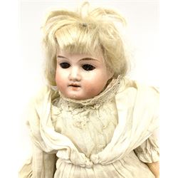 Armand Marseille Koppelsdorf bisque head doll with applied hair, sleeping eyes, open mouth with teeth and composition body with jointed limbs, marked 'AM Koppelsdorf Germany 1330 A12M' H62cm; and two similar smaller AM dolls marked '390 A3/0 XM' and 'AM Germany 351./3.K.' (3)