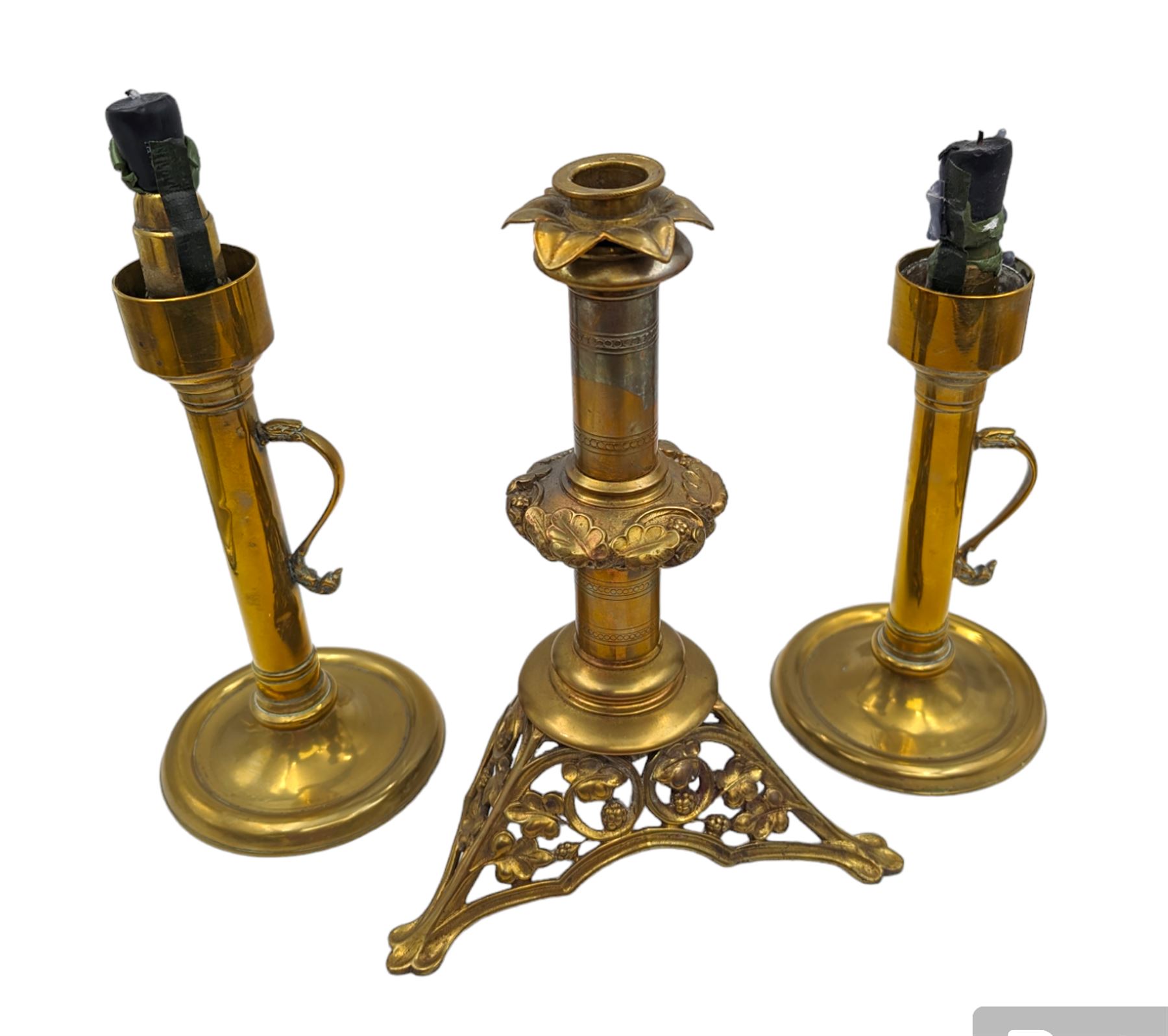 Brass candlestick with a knopt stems and triform base, together with two other brass candlestick 