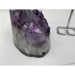 Amethyst crystal geode cluster, with large well-defined crystals, upon a metal stand, H21cm