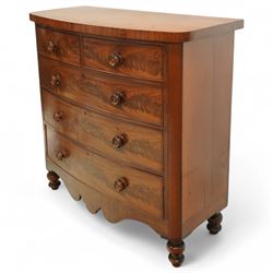 19th century mahogany bow front chest, with figured drawer fronts comprising two short over three long drawers, all with turned handles, shaped lower frieze and raised on turned supports