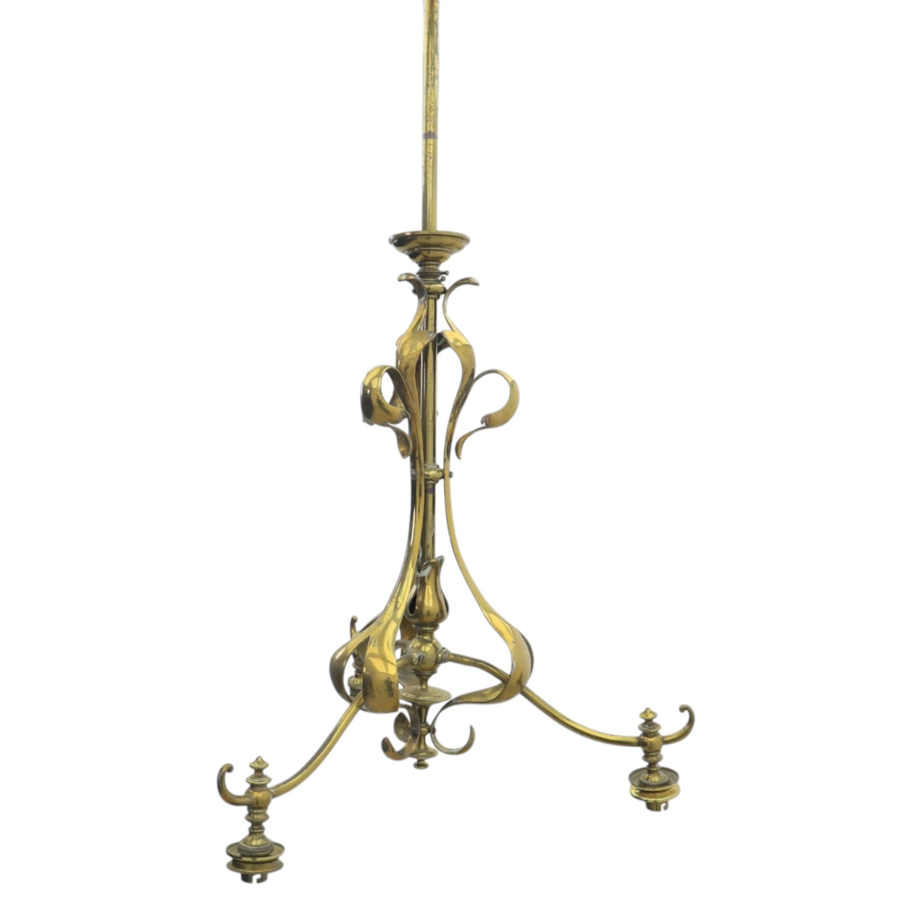 20th century Art Nouveau brass wall light, vertical stem with three scrolling arms terminating in lamp holders, central baluster element with curving supports