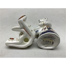 Four Royal Crown Derby teddy paperweights, comprising Teddy Cook, two Teddy George and Seated Teddy, all without stoppers, together with Crown Namestake with gold stopper 