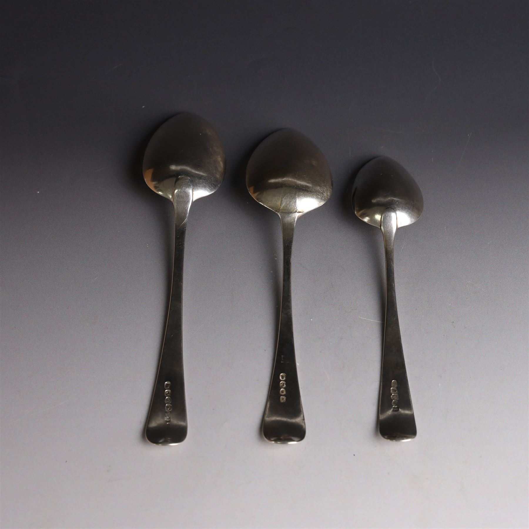 Three George III silver Old English pattern spoons, comprising table spoon with engraved monogram to terminal, hallmarked Thomas Wilkes Barker, London 1806, another table spoon hallmarked London 1806, and a Scottish silver dessert spoon hallmarked James Orr, Edinburgh 1805