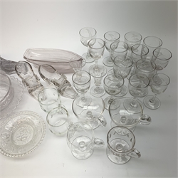 A collection of clear glass, comprising thirty two various drinking glasses, some with engraved foliate detail, eight custard cups, a Victoria Golden Jubilee glass bowl, Gladstone commemorative dish, three glass shoes, and Grace Darling lifeboat.