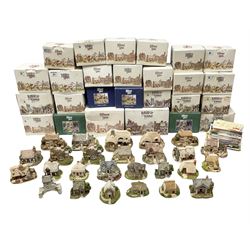 Twenty six Lilliput Lane models from the British and English Collections to include 'Ostlers Keep', 'Holme Dyke', 'Dovetails', 'Victoria cottage' etc, all boxed with deeds