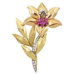 18ct gold diamond and ruby lily brooch, the platinum channel set diamond stem, amongst yellow gold polished and textured leaves, the milgrain set diamond and claw set ruby pistil amongst rose gold petals