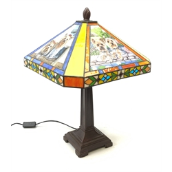 A Tiffany style table lamp, the leaded glass panel decorated with with panels of Yorkshire Terrier, H52cm. 