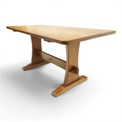 Acornman - 5' adzed oak dining table, rectangular top above a trestle base united by a stretcher with carved acorn signature, by the workshop of Alan Grainger of Brandsby