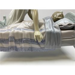 Lladro figure, Sleep Tight, modelled as a mother putting her daughter to bed, in original box, no 5900, year issued 1992, year retired 1997, H20cm