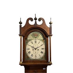 English oak cased longcase clock c1830, tall swan neck pediment with three ball and spire finals and brass paterae, break arch hood door flanked by two tapered columns with gesso capitals, with a slim trunk and full length door with a decorative ogee spire, on a square plinth with applied skirting, painted break-arch dial with depictions of flowers to the spandrels and break arch, spandrels and arch with raised gesso detailing on a green background, dial with Roman numerals and five-minute Arabic's, minute track, subsidiary date and seconds dial, with steel hands and calendar pointer (no second's hand), dial pinned via a cast falseplate to an eight-day rack striking movement, striking the hours on a bell. With weights,  pendulum and key.


