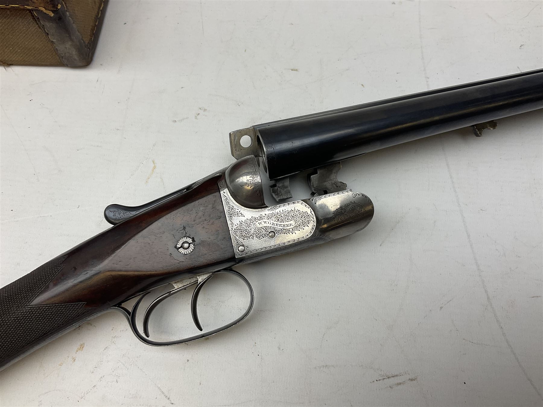 W.W. Greener 12-bore side-by-side double barrel non-ejector shotgun, with 76cm barrels, side safety, engraved lock, figured walnut stock with chequered grip and fore-end, no.33408, 120.5cm overall; in fitted canvas covered case with tools and accessories including .22 12-bore dog training device. SHOTGUN CERTIFICATE REQUIRED.