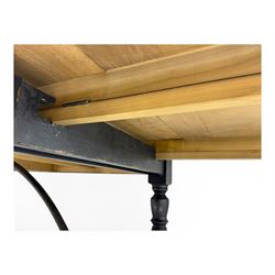 Barker & Stonehouse - large oak extending draw-leaf dining table, rectangular plank top over a black painted base, turned supports joined by shaped stretchers, extending at each end with pull-out leaves