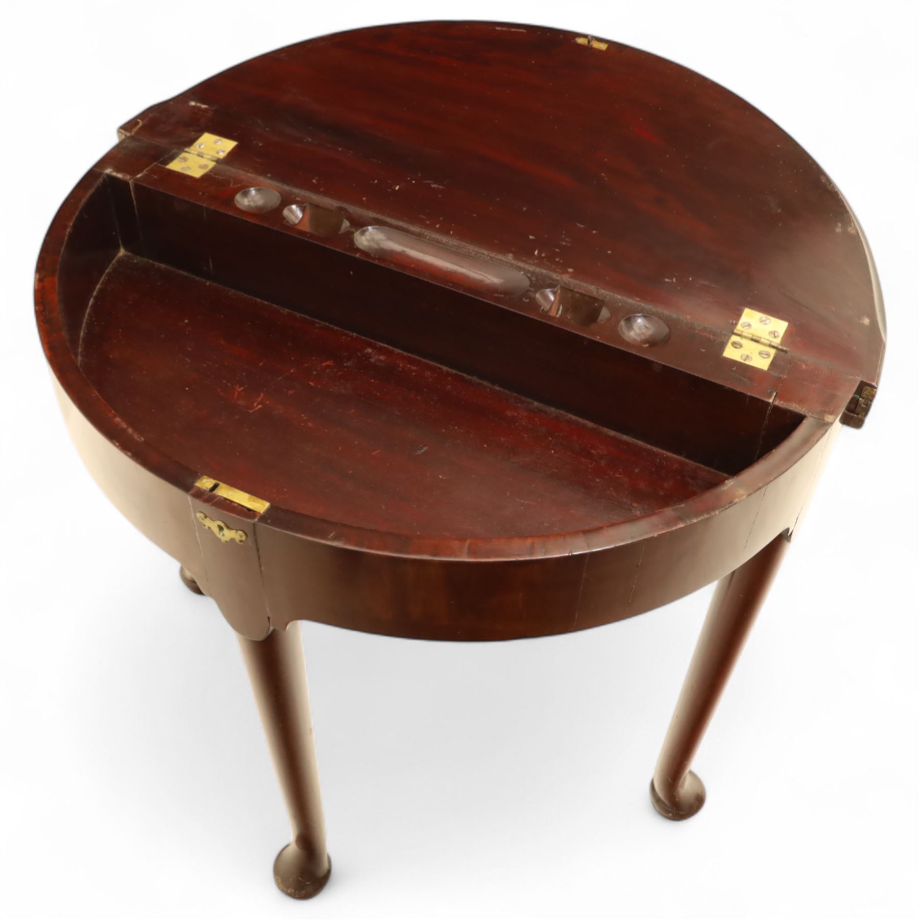 20th-century Georgian Revival style double fold-over card table, the first hinged circular top with polished mahogany surface above a second hinged circular top revealing a green baize playing surface with four counter-wells, underneath with a recessed compartment with and  chip and dice wells, the apron with fitted lock and key, raised on slender straight legs with pad feet 