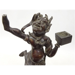  19th century bronzed spelter figure of a demon, possibly Japanese, modelled as a dancing figure supporting two square blocks, mounted on matched wooden base, H42cm   