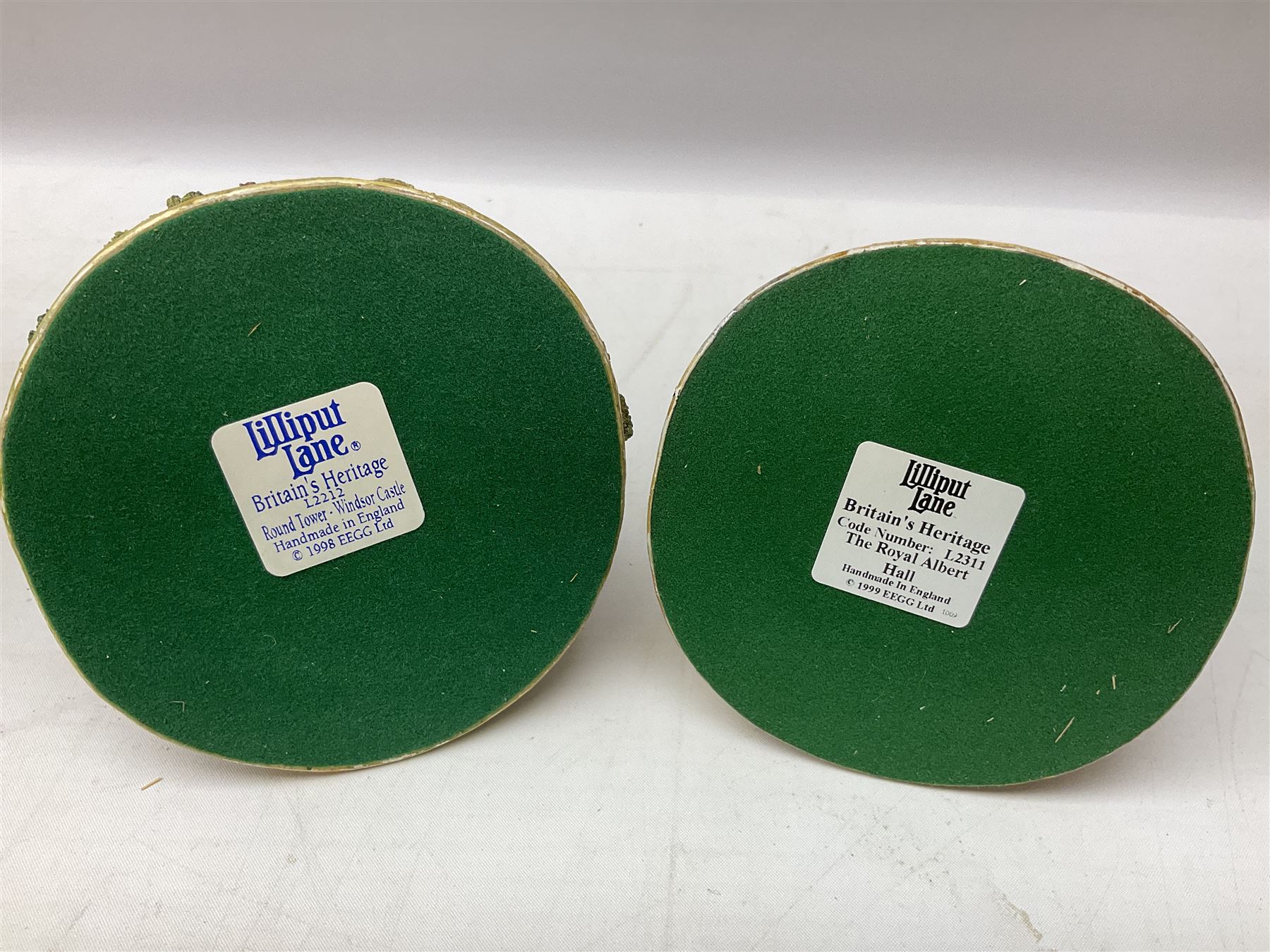 Five Lilliput Lane models from the 'Britain's Heritage' collection, comprising The Royal Albert Hall, Windsor Castle Round Tower, Eros and Nelson's Column and another snowed, all boxed