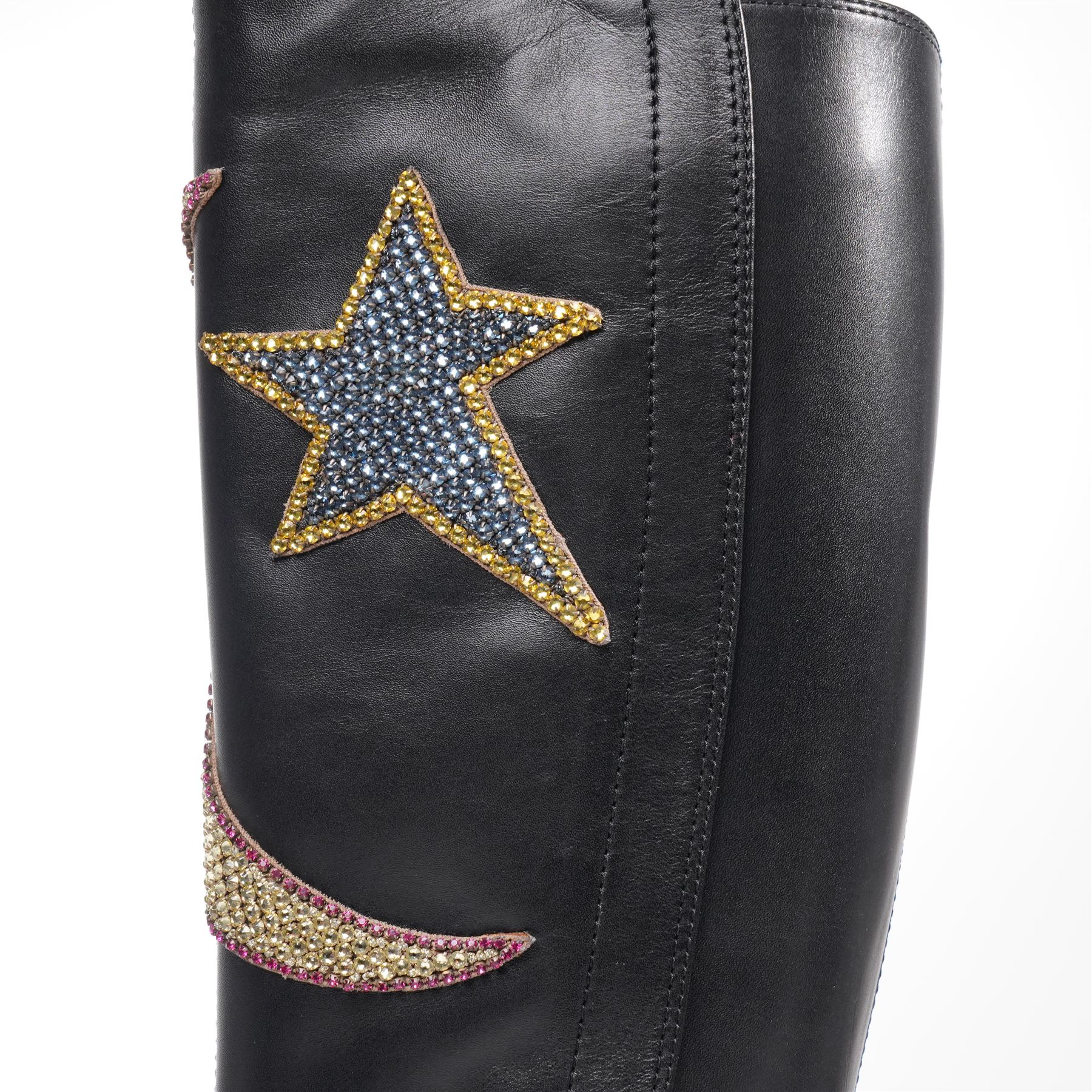 Gucci - pair of Dionysus buckled knee-high leather boots, in black with block heels, applied with rhinestone star, moon and heart applique motifs, with the signature silver tone tiger head buckle fastening and full length zip, size 38, total boot height 48cm, unused with original box and dust bags