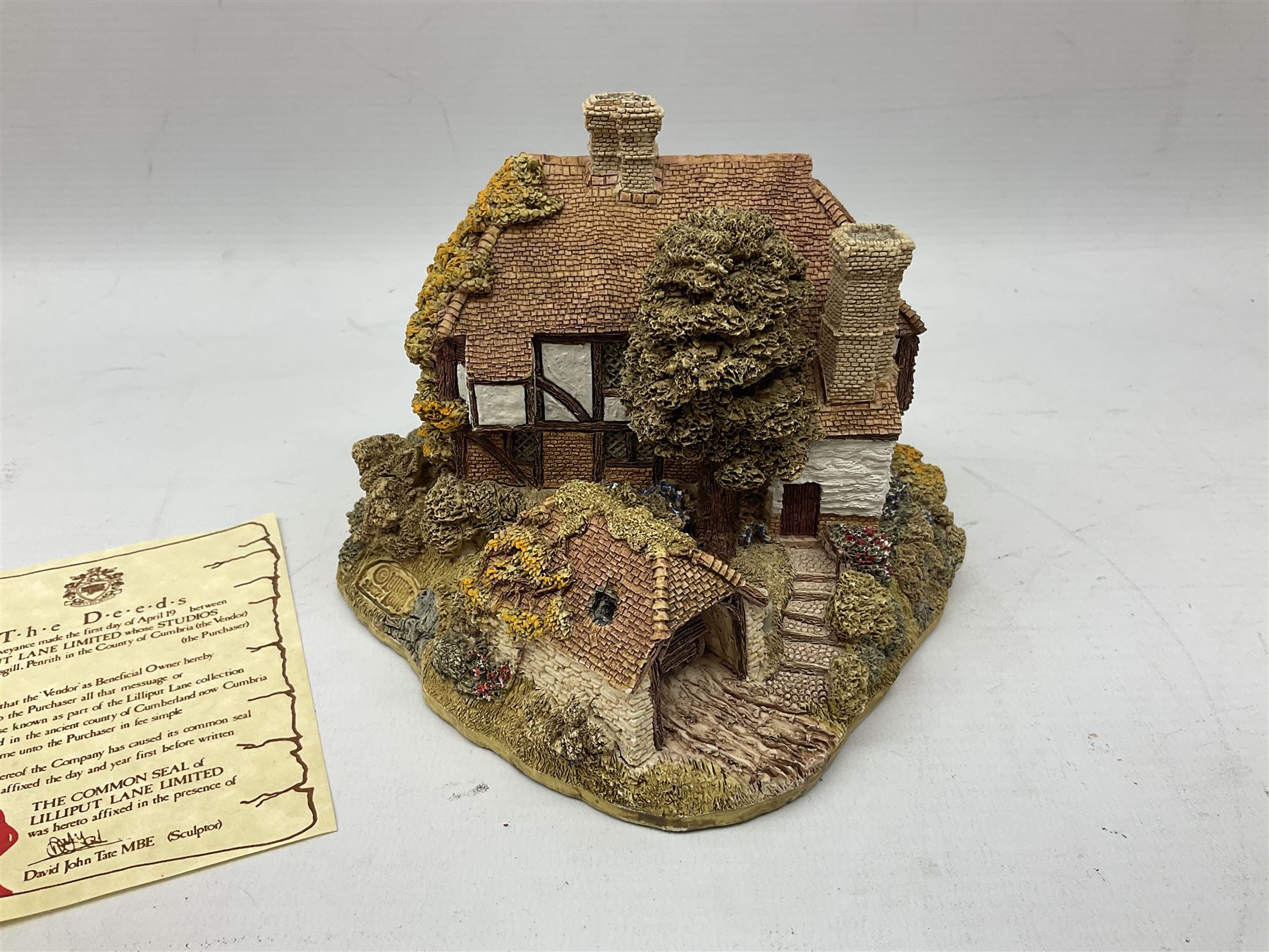 Nine Lilliput Lane cottages from the British and English collections to include Crown Inn, Wealden House, Puffin Row, etc, all boxed, one without deeds