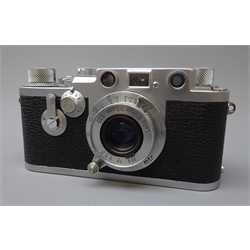  Leica DBP 35mm film camera, Ernst Leitz Wetzlar GMBH Germany Nr.811850, with a Leitz Elmar 1:3,5 f=5cm lens, in leather case  