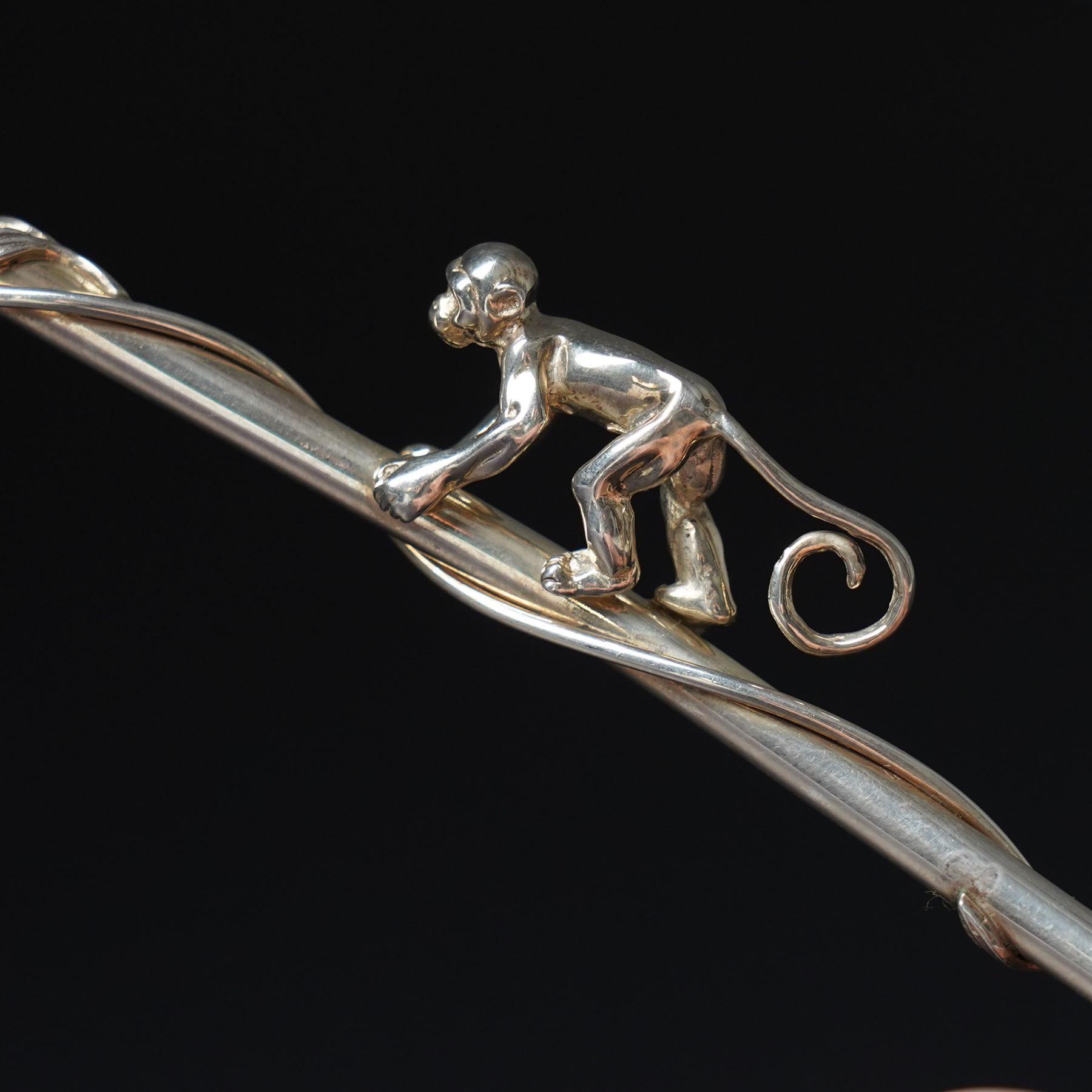 A pair of Tiffany & Co. novelty silver drinking straws, each modelled as a bamboo stem entwined with leaves and applied with a climbing monkey figure, engraved with names and date, stamped TIFFANY & CO. 925, W21cm