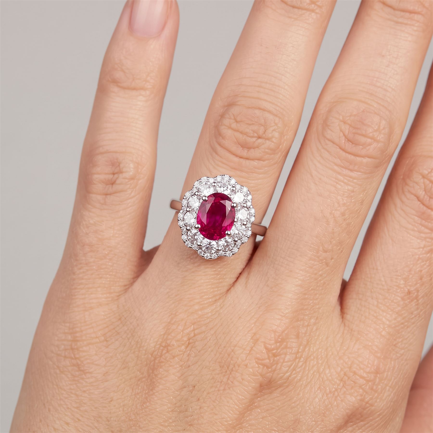 18ct white gold unheated oval ruby and round brilliant cut diamond cluster ring, hallmarked, ruby 3.07 carat, total diamond weight approx 1.65 carat, with WGI certificate