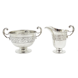  Silver twin handles pedestal dish and matching cream jug, Celtic design by Charles Weale, Birmingham 1927, also with Dublin import marks 1927, approx 7.8oz  