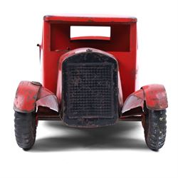 Tri-ang/Line Bros Ltd tin plate tipper truck, red body with black rubber wheels and red seat and steering wheel to interior, H49cm, L16cm