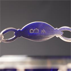 Edwardian pierced silver sugar basket with swing handle and blue glass liner H9cm London 1906 Maker Haseler Bros. and another decorated with floral swags Chester 1912 Maker  (2)