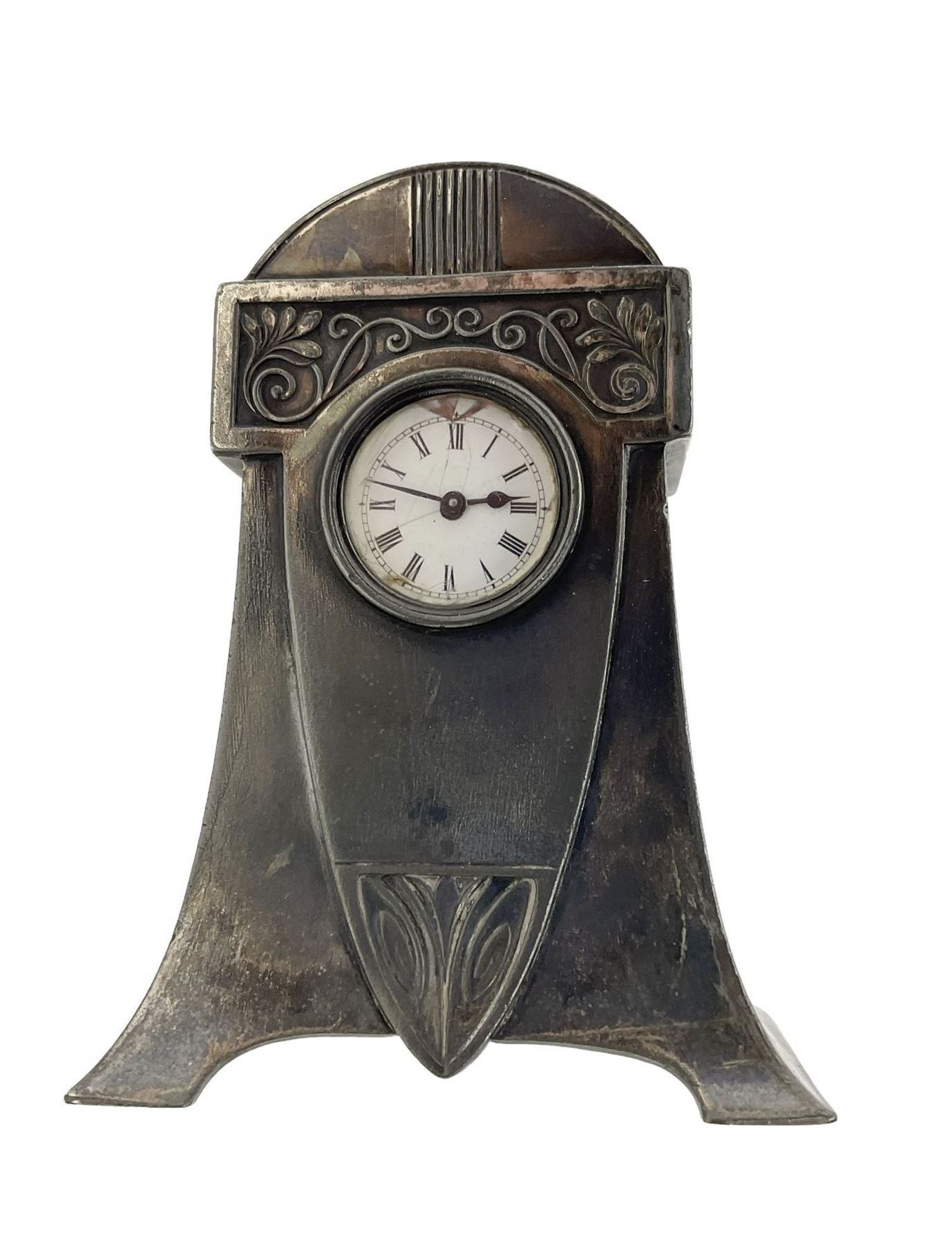 Metallwarenfaberic Straub & Schweizer - WMF silver plated timepiece clock c1910 in the aesthetic movement style, recessed enamel dial with Roman numerals, minute track and steel spade hands, single train going barrel movement  with a jewelled cylinder balance wheel escapement, wound and set from the rear, case with makers marks. 