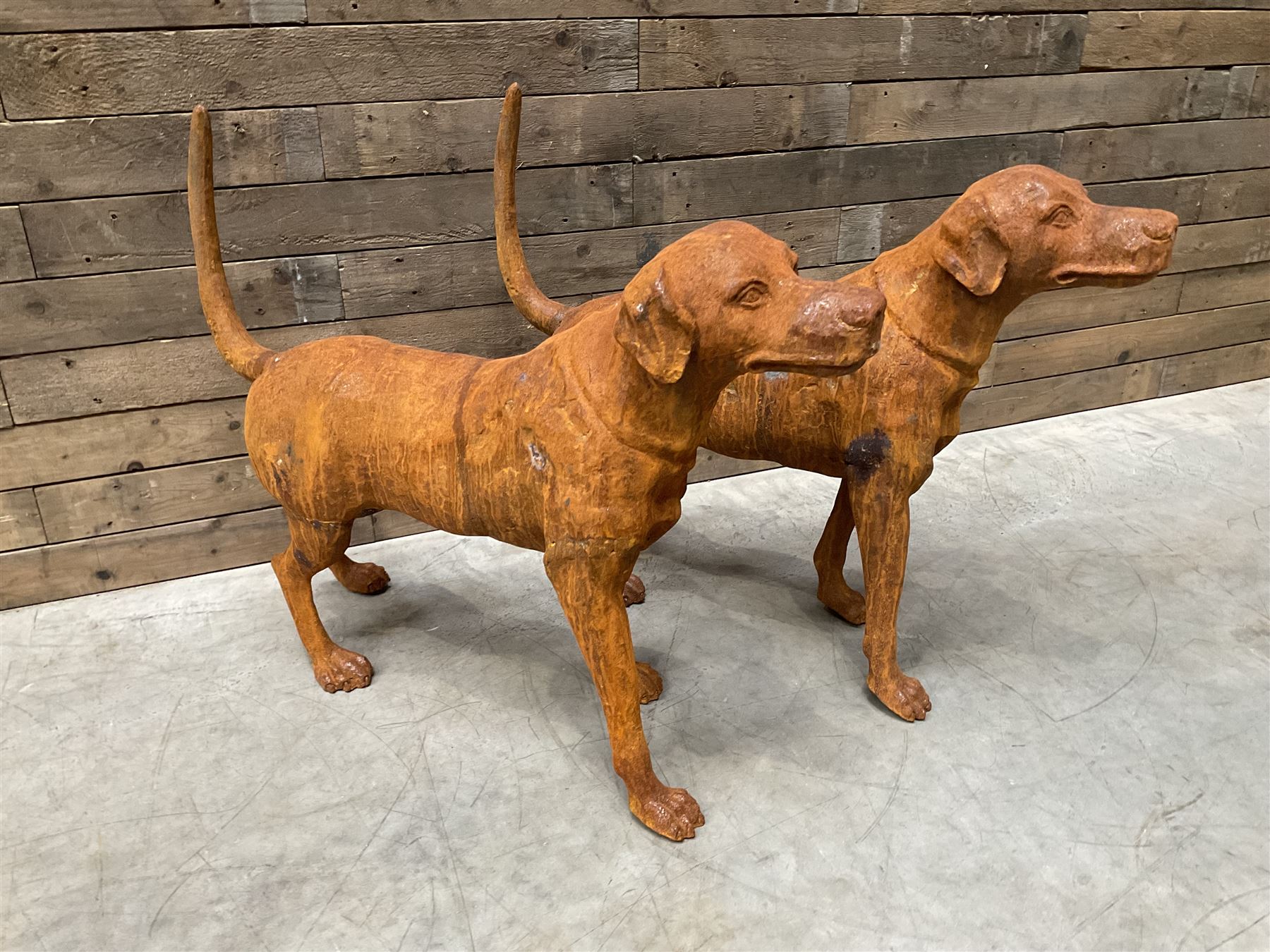 Pair of life-size heavy cast iron garden Hunting dogs