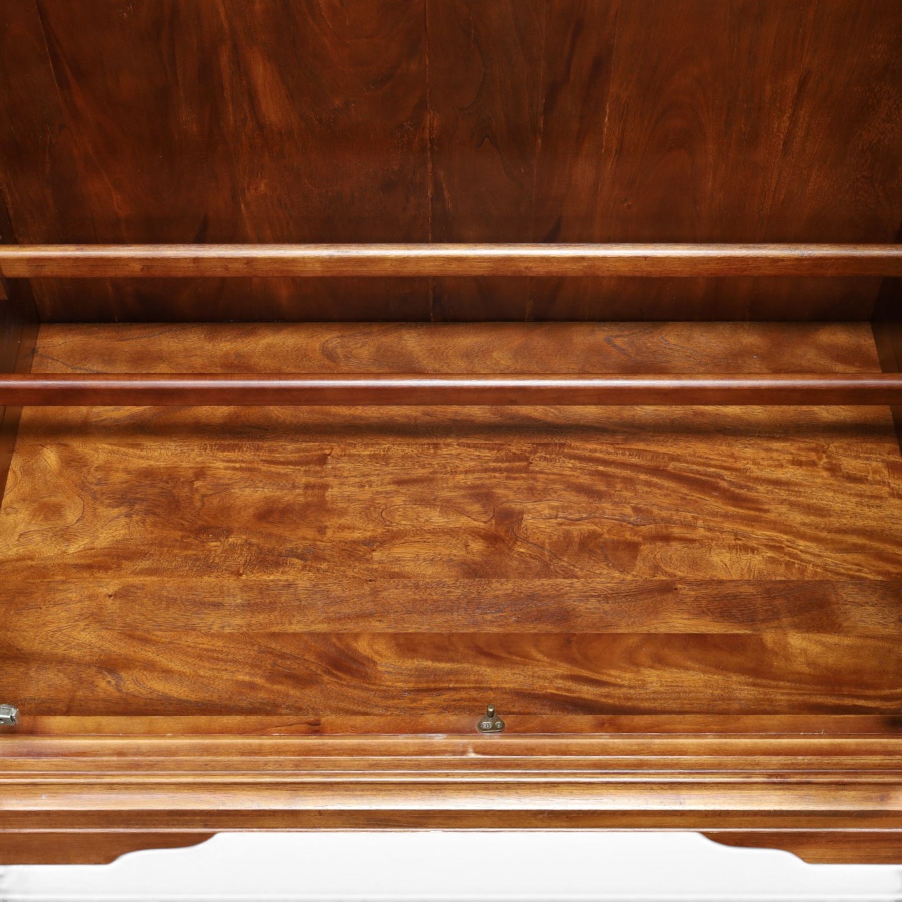 Willis & Gambier - mahogany bedroom wardrobe, projecting cornice with two additional rails, panelled doors with trouser rack and blue baize trinket, enclosing a shelf above a wooden clothes rail and shoe rack, raised on bracket feet 