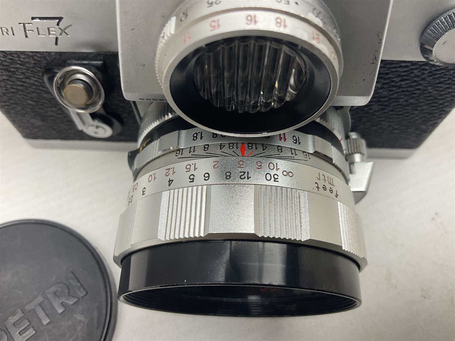 Petri Flex 7 camera body, serial no. 555698, with Perti C.C 1:1.8 f=55mm' lens, serial no. 78253, together with Petri Flex V2 camera body, serial no. 364427, with 'Petti C.C. 1:2 f=55mm' lens, serial no. 137076, in ever ready case