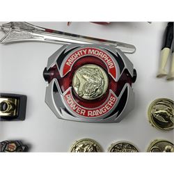 Collection of early 90s Mighty Morphin’ Power Rangers Zords, figures and accessories. Titanus the Carrier Zord, marked Bandai 1991; Green Dragonzord, incomplete; 1994 White Tigerzord with original instruction manual; 1993 Triceratops Dinozord, Mastodon Dinozord and Sabertooth Tiger Dinozord, Pterodactyl Dinozord, missing guns; with 1993 Power Morpher and original Power Coins, with further related figures, accessories and weapons