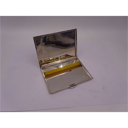 Mid 20th century silver cigarette case, of rectangular form with geometric engraved decoration, hallmarked Dudley Russell Howitt, Birmingham 1947, H8.5cm