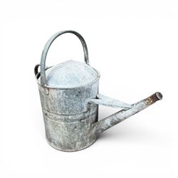 Eight early 20th century galvanised watering cans