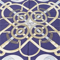 Hermès - ‘Éperon d’Or’ silk scarf, designed by Henri d’Origny, first issued 1974, navy, pale blue, ivory and gold colourway with hand-rolled edges