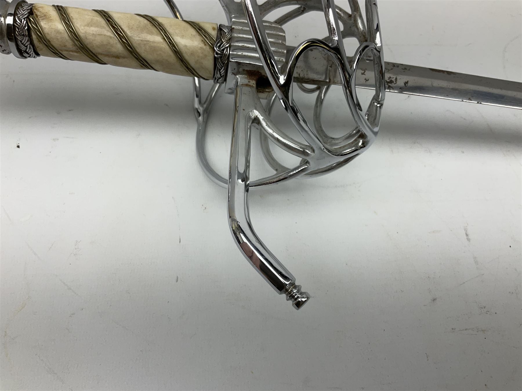 Replica knight's longsword, the 91.5cm double-edged steel blade with basket hilt and wire-bound bone grip with spherical pommel, in leather scabbard L112cm overall