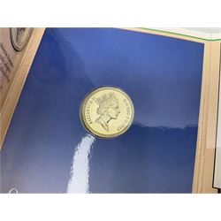 Two Great Britain and Northern Island proof sets dated 1970 and 1971, both with card cases, three 1986 Commonwealth Games commemorative two pound coins, in card folders, and six brilliant uncirculated one pound coins, in card folders
