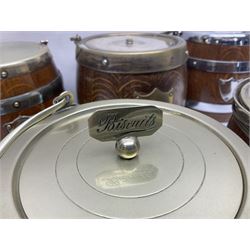 Five early 20th century biscuit barrels with silver-plated mounts