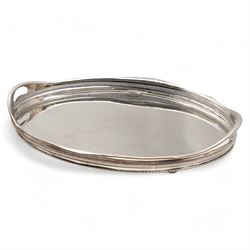 Silver plated oval gallery tray with pierced border and gadrooned edge with integral handles L63cm