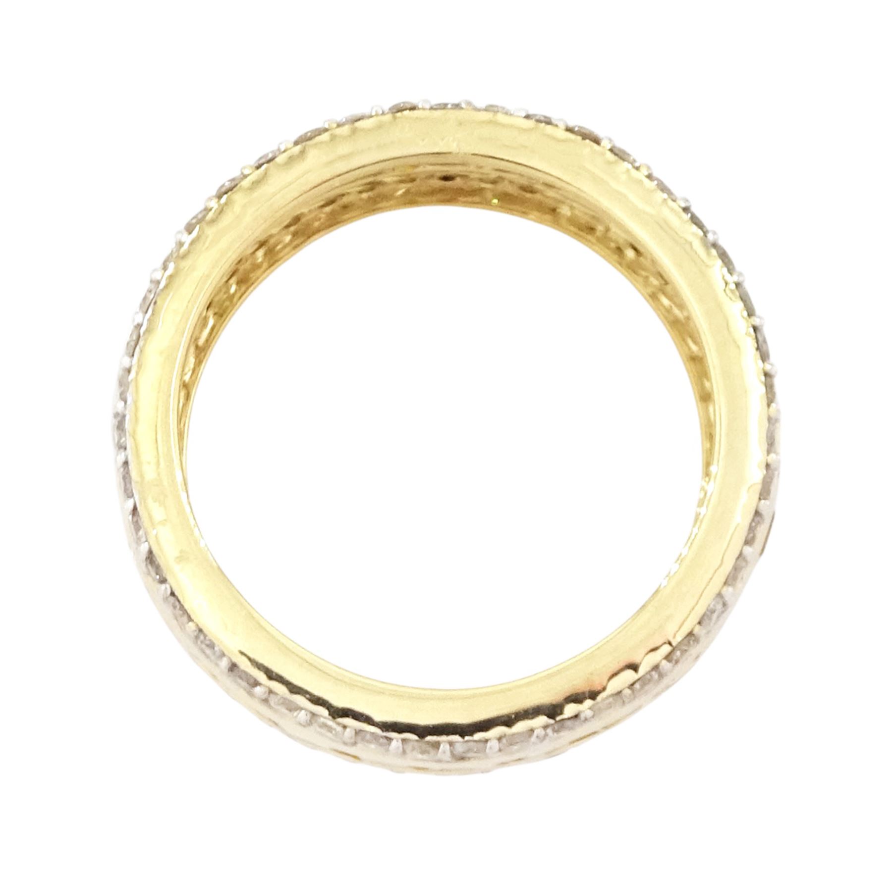 Gold yellow sapphire and diamond three row full eternity ring, channel set calibre cut sapphires, with a row of round brilliant cut diamonds set either side, stamped 9K, total sapphire weight approx 2.95 carat, total diamond weight 0.85 carat